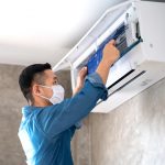 Technician,Man,Repairing,,cleaning,And,Maintenance,Air,Conditioner,On,The