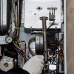 Heating,Central,Gas,Furnace,Issue.,Technician,Trying,To,Fix,The