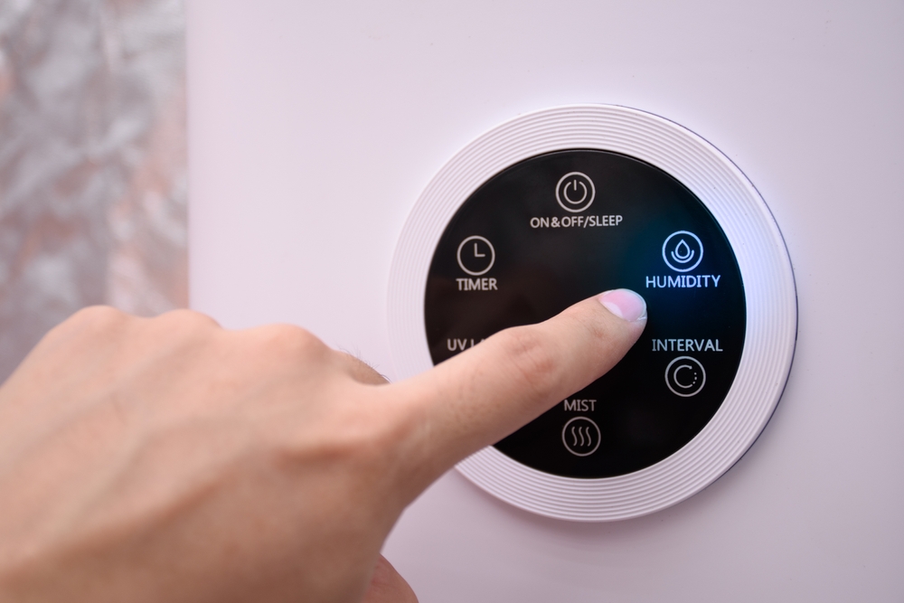 Close,Up,Man,Hand,Pressing,The,Digital,Humidifier,Button,On